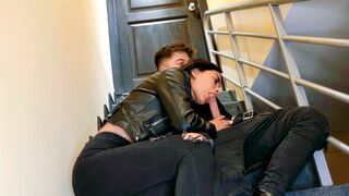 A young couple has sex on the stairs of their apartment