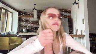 A pretty woman with glasses gets her face covered with sperm after a blowjob