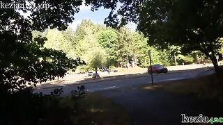 Kezia teaches how to squirt on the city sidewalk in the park