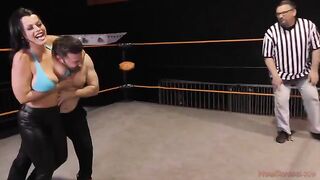 Nadia White, the busty brunette MILF, dominates her man in a fierce wrestle match