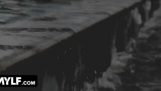 A hot MILF is having fun with a young guy in the pool