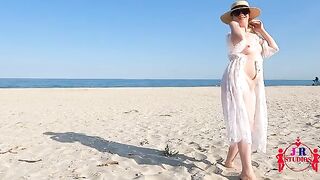 A blonde woman poses naked and has sex on a public beach