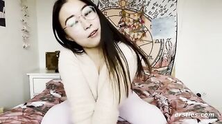 A beautiful Chinese girl with glasses masturbates and reaches a strong orgasm