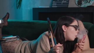 A girl in glasses gets her big dick sucked while smoking and more