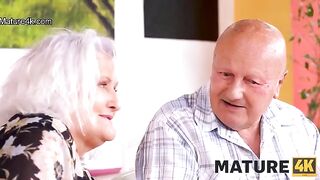 A hot mature woman gets fucked on the table by a guy