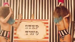 The clowns have fun with the girls in a playful, role-playing setting