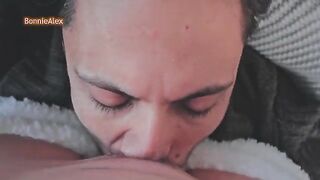The guy caresses his girlfriend in pajamas while they kiss