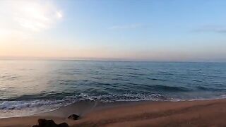 A girl is having sex on the beach and she loves it