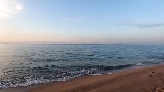 A girl is having sex on the beach and she loves it