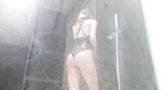 A hot woman wets her pussy in the shower and cums