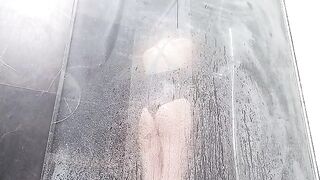 A hot woman wets her pussy in the shower and cums