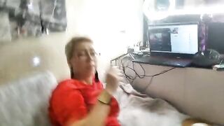 A mature woman is playing dirty games on camera