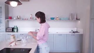I cook and undress at a friend's house, showcasing sensual solo moments in the kitchen