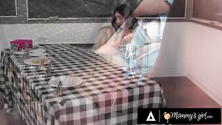 A hot MILF is getting intimate with her stepdaughter in a steamy scenario
