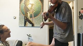 The couple was trying to practice violin but couldn’t