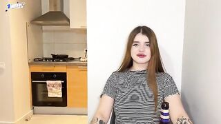 A cum shot on the face of a hot tattoo girl