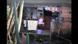 A hidden camera has been set up in the room, and a black woman is unaware of it