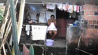 A hidden camera has been set up in the room, and a black woman is unaware of it