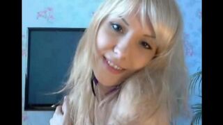 Blondie plays with her pussy using her fingers in a sensual act