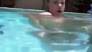 Girl at the bottom of the pool penetrates her ass with a toy