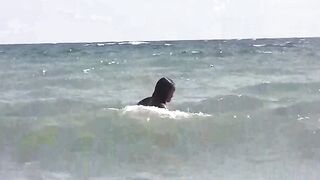 Two girls are not shy to get sunbathe on a naked beach