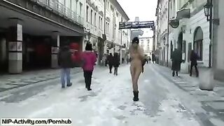 A sexy student bares her boobs and ass on the city streets in a daring stunt