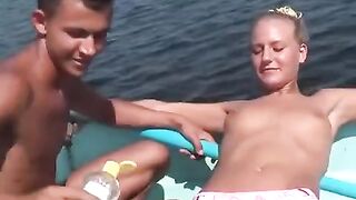 Young people are debauchery on the river. Outdoor fun gets wild