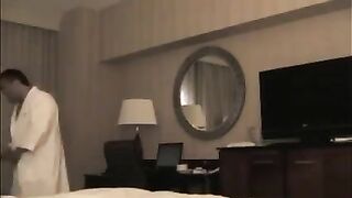 A man checks the girl in the hotel and undresses her