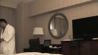 A man checks the girl in the hotel and undresses her