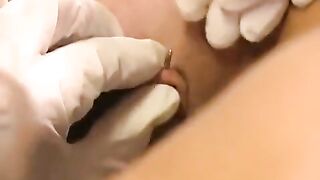 A girl with a clit piercing plays with different sex toys