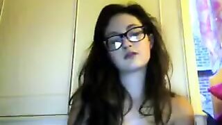 A cute student with glasses plays a steamy video chat
