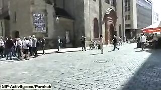 The girl shows her pussy to all the people on the street