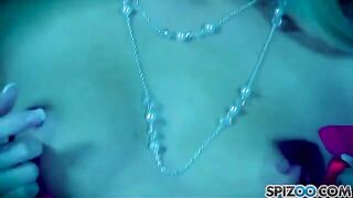 A blonde beauty caresses herself with a dildo in her pussy