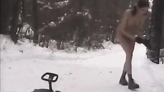 Girls are having fun with snowballs in the street naked