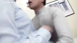 A girl in a skirt seduces a guy on the bed