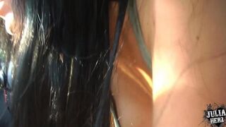 The beautiful girl is doing a blowjob right in the car
