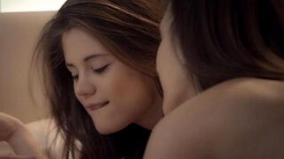 The beauties are licking each other's pussies on the bed in a sensual scene