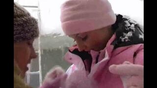 Two lesbians are having fun on a cold winter day
