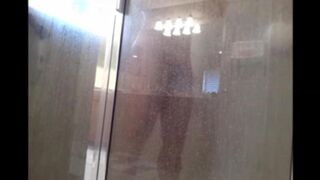 The man washes his body in the shower, but there’s a camera