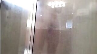 The man washes his body in the shower, but there’s a camera