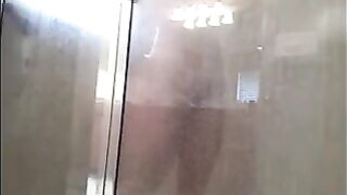 The man washes his body in the shower, but there’s a camera