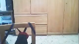 A woman fucks in front of the webcam, her husband is nearby