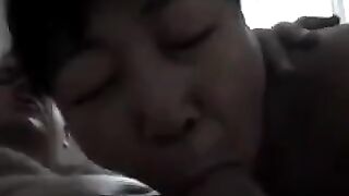 The Chinese woman practices blowjob with her mouth