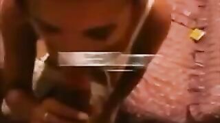 She stands on her knees, elbows spread, wanking guy’s cock