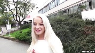 A blonde with natural tits has sex on camera