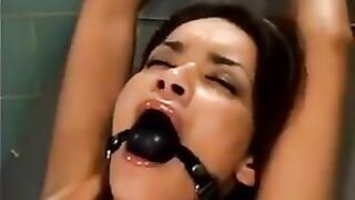 A bald guy fucked a girl with a machine for fucking in BDSM