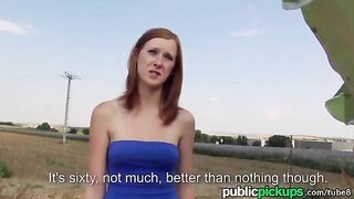 A red-haired girl has sex on a haystack in the open air