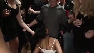A sexy woman in rough bondage sex with many men