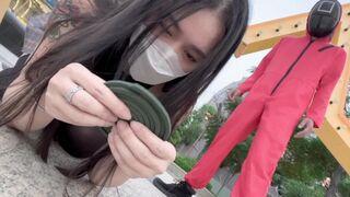 A hot Chinese girl participates in a daring twist of the Squid Game challenge