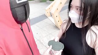 A hot Chinese girl participates in a daring twist of the Squid Game challenge